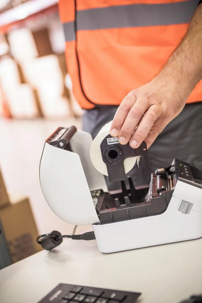 Brother QL1110NWBC | Etikettendrucker | Anschließbar an PC | USB, LAN, WiFi, Bluetooth | bis zu 110 mm/sec | DK-Rollen bis zu 101,6 mm (4") | Druck in Schwarz auf Weiß